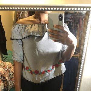 An off-the-shoulder checkered top.